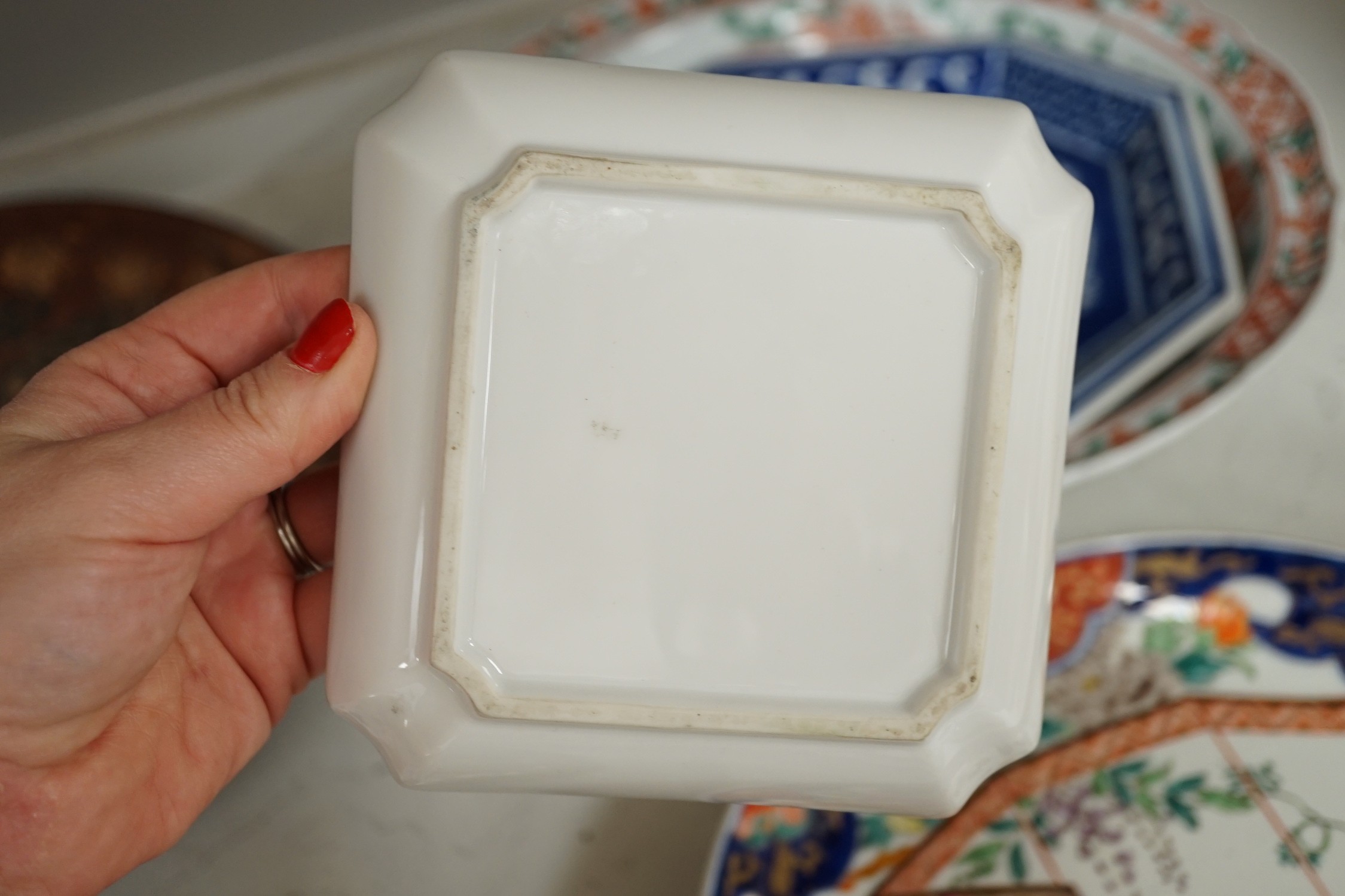 A group of 19th/20th century Japanese porcelain and pottery dishes. Largest 33cm diameter